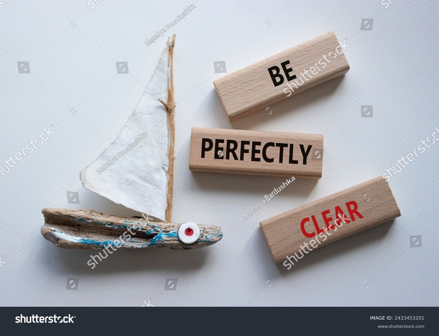 Be perfectly clear symbol. Concept words Be perfectly clear on wooden blocks. Beautiful white background with boat. Business and Be perfectly clear concept. Copy space #2433453201
