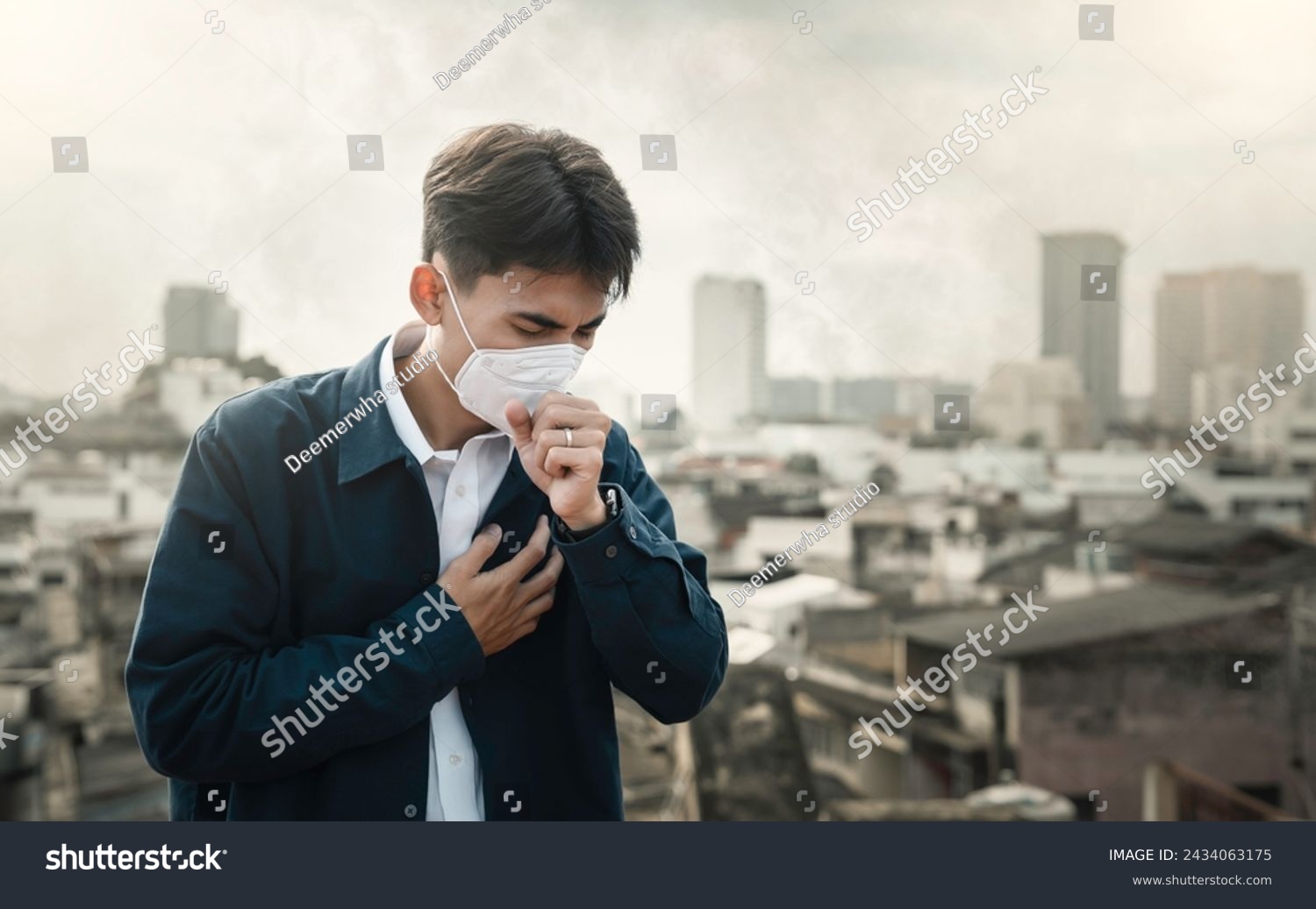 air pollution quality of dust PM 2.5 is toxic and dangerous to health. Business man wearing Protection mask unhealthy air pollution dust smoke in an urban city and smog with bad weather #2434063175