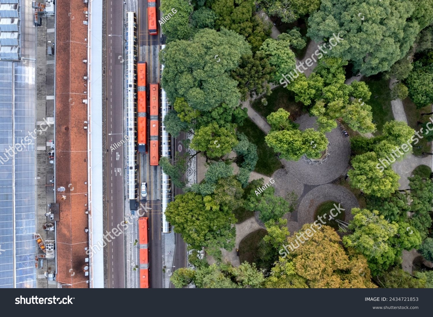 Aerial view of Curitiba, Brazil, and its buses and tube stops, and a verdant green park #2434721853