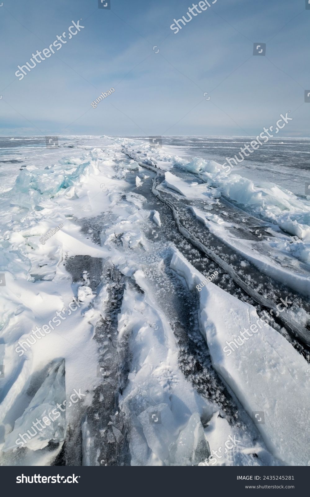 Ice of lake Baikal in winter, the deepest and largest freshwater lake by volume in the world, located in southern Siberia, Russia #2435245281