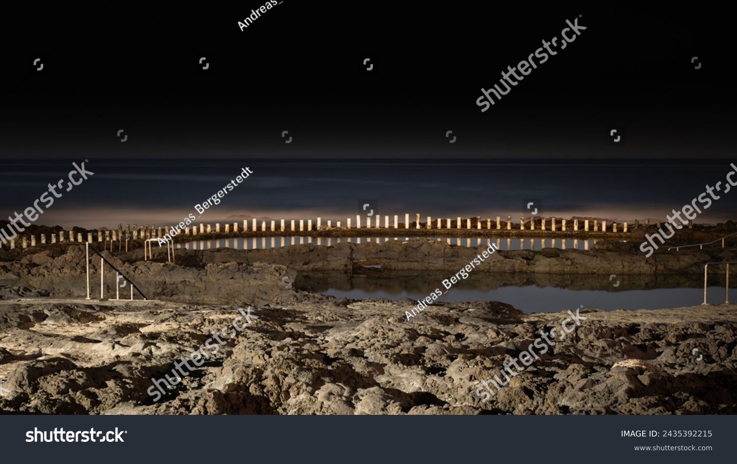 Natural sea water swimming pools of Agaete, Puerto de las nieves in Gran Canaria, Spain. Night time long exposure with no visible people and sea horizon #2435392215