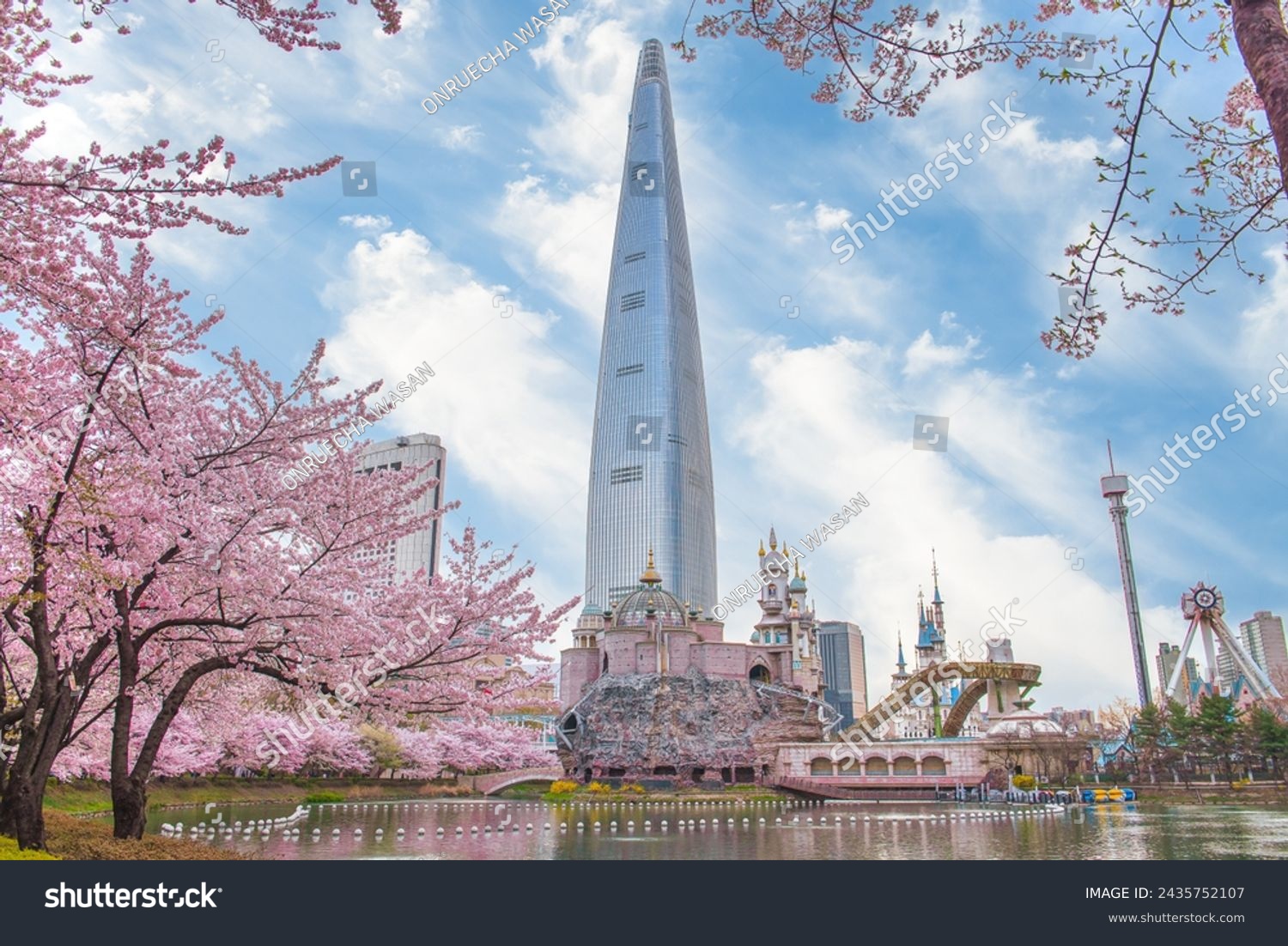 Lotte World Amusement Park and Seokchon Lake  in Spring Cherry blossoms bloom in late March-April.  Seoul, South Korea #2435752107
