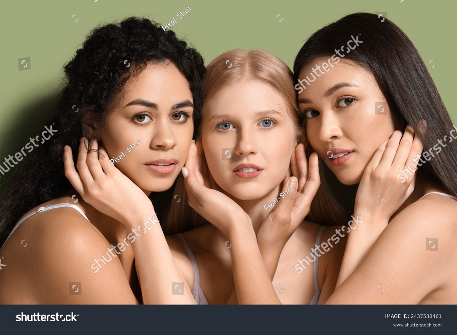 Beautiful young women on green background, closeup #2437538461