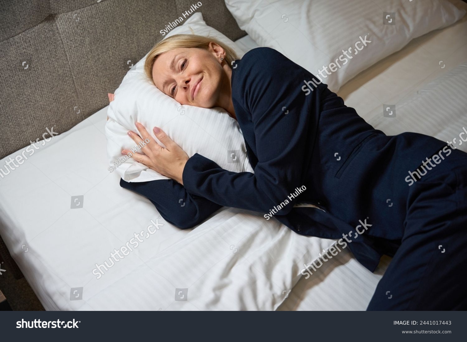 Dozy business lady is resting in her bedchamber #2441017443