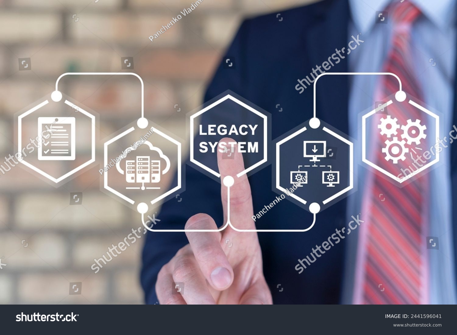 Businessman using virtual touch screen presses inscription: LEGACY SYSTEM. Legacy Systems Business Technology Interoperability Upgrade concept. #2441596041