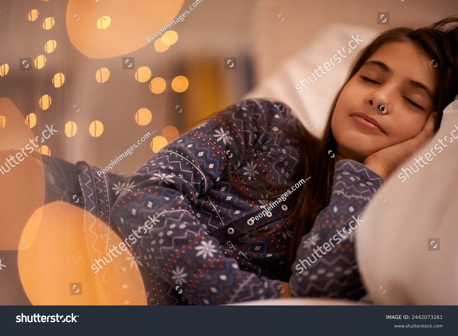 Child, sleeping and bed for dream, tired and rest for young and growing up for adolescent indoor. Girl or kid with pajamas and laying with pillow for exhausted in house for peace and calm on bokeh #2442073261