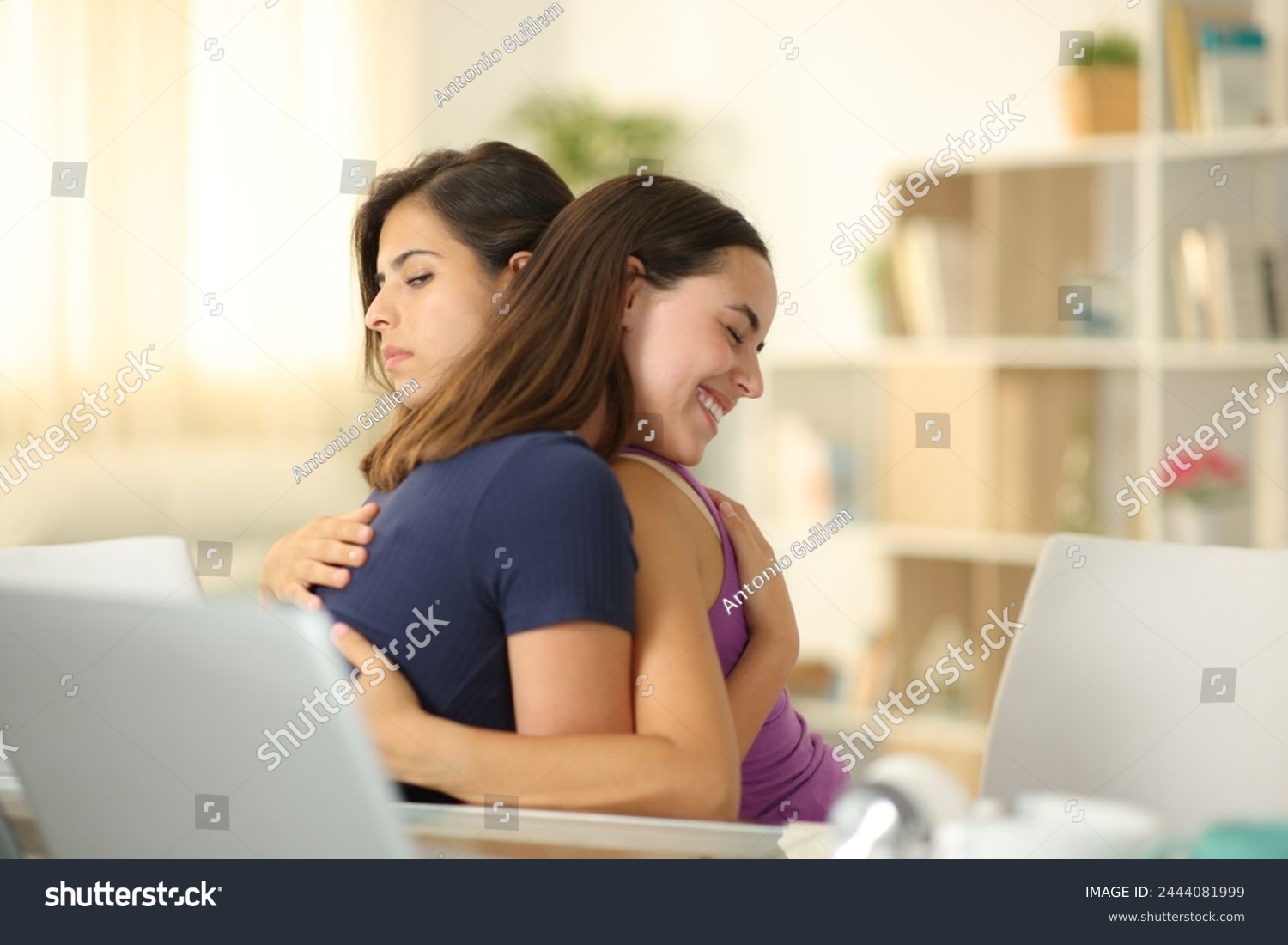 False woman hugging a cheated friend at home #2444081999