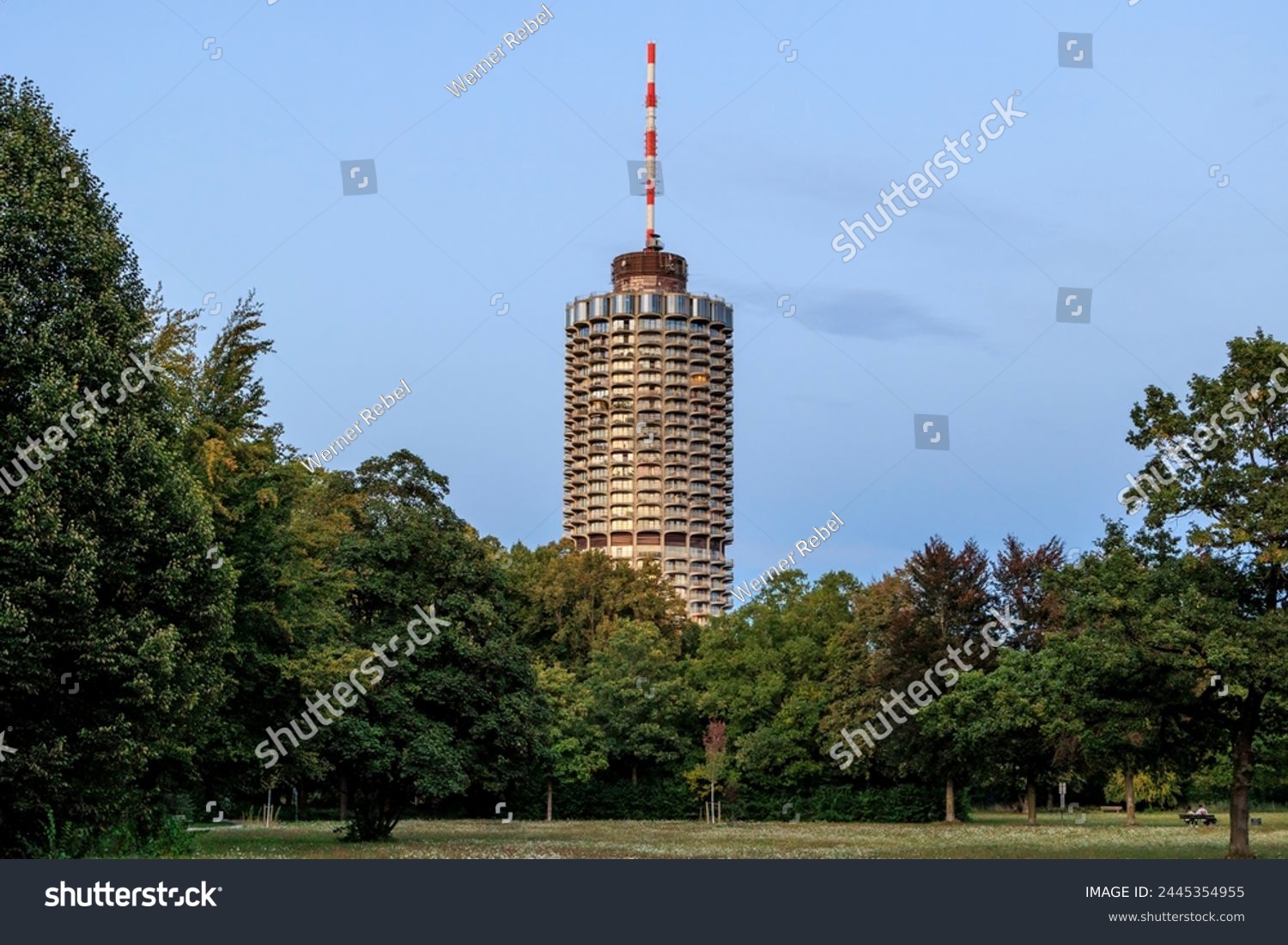 Hotel tower in Augsburg popularly called corncob in Wittelsbacher Park on a summer evening with evening glow #2445354955