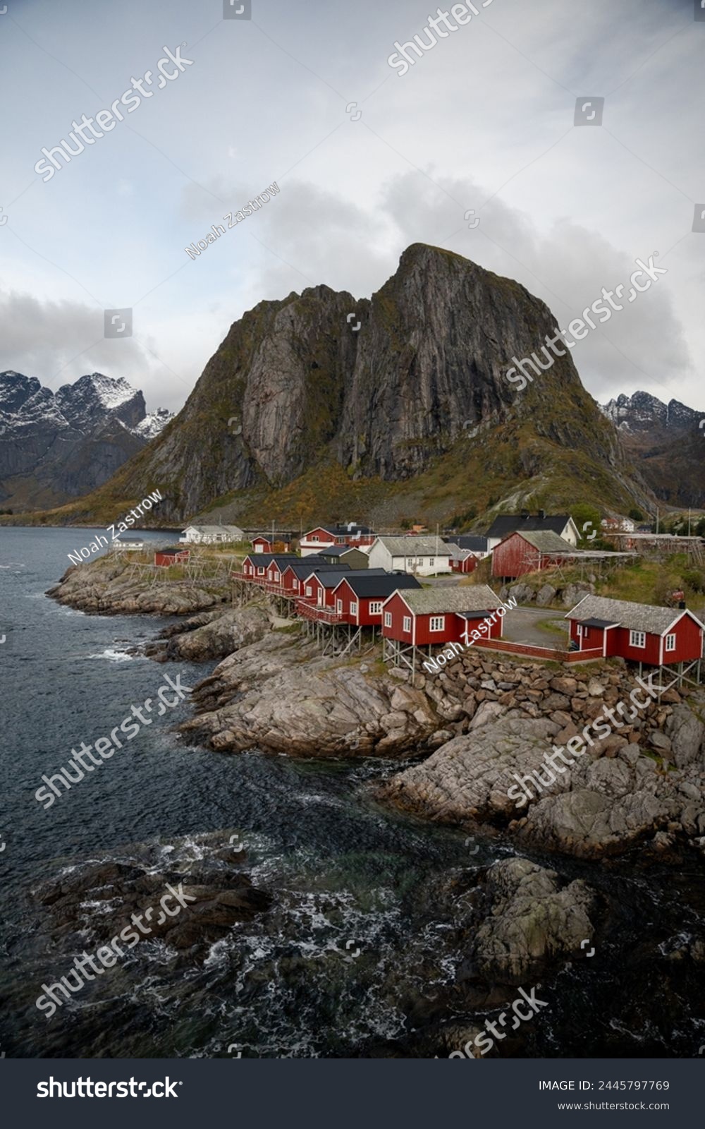 Famous photography spot of Hamnoy red rorbu fishing houses from the nearby bridge.  Located in Lofoten, Norway in the Arctic circle.  A famous fishing village. #2445797769