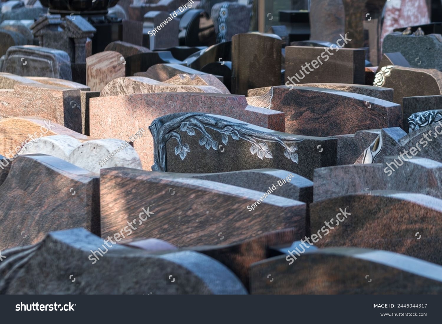 Many gravestones are for sale from a stonemason #2446044317