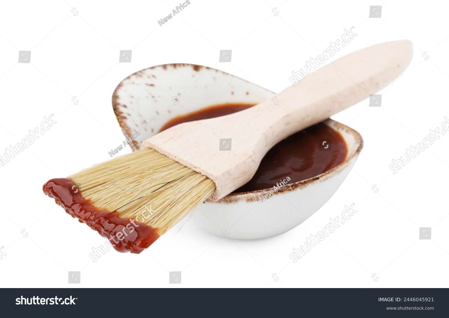 Marinade in gravy boat and basting brush isolated on white #2446045921
