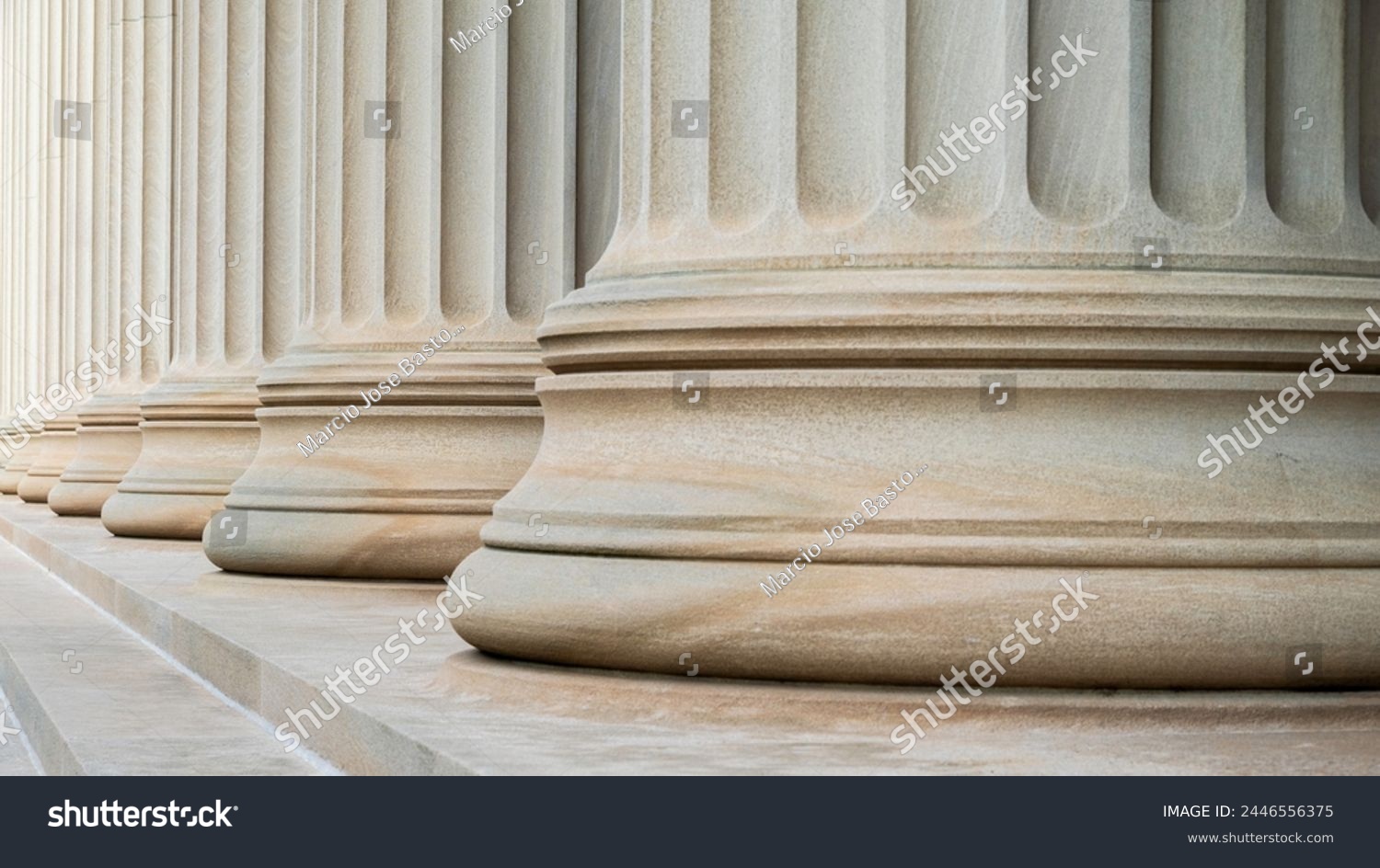 Architectural detail of some neoclassical columns symbolizing justice and the law of the land. #2446556375