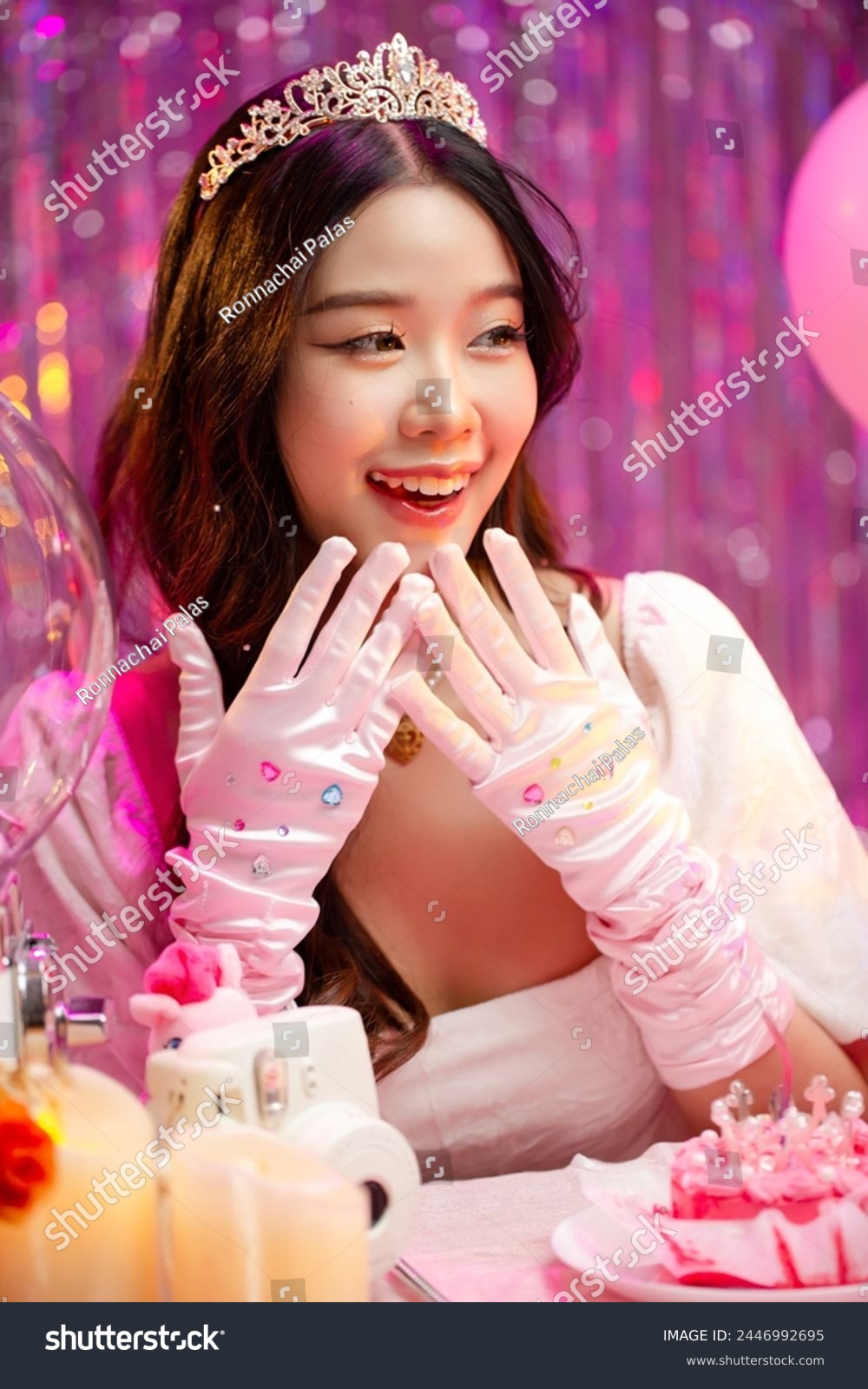 Happy beautiful Asian girl in princess dress showing birthday cake. Birthday princess photography theme is popular in social network. #2446992695