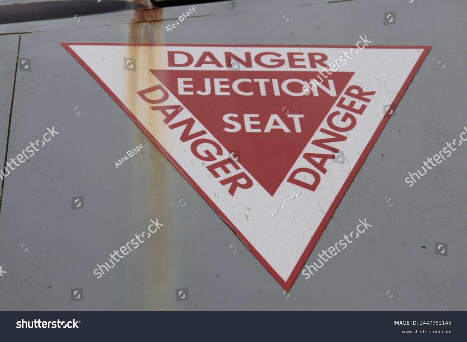 military airplane danger ejection seat sign on the side of a plane #2447752145