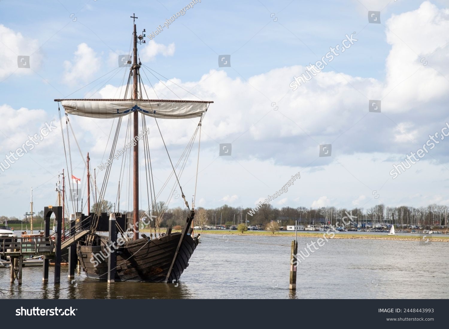 Replica of an old merchant ship -Kamper Kogge, along the river IJssel near the Dutch historic Hanseatic city of Kampen in Overijssel. #2448443993