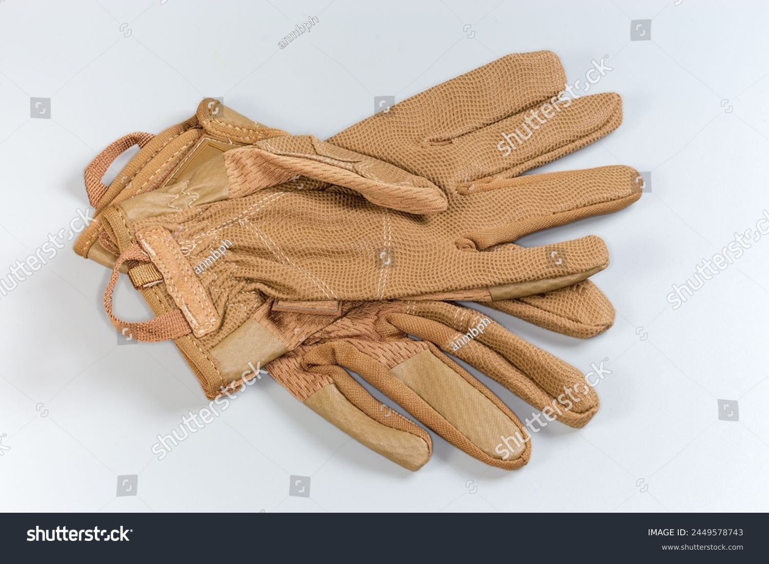 Pair of the beige tactical military gloves made with textile and synthetic leathern on a gray background
 #2449578743
