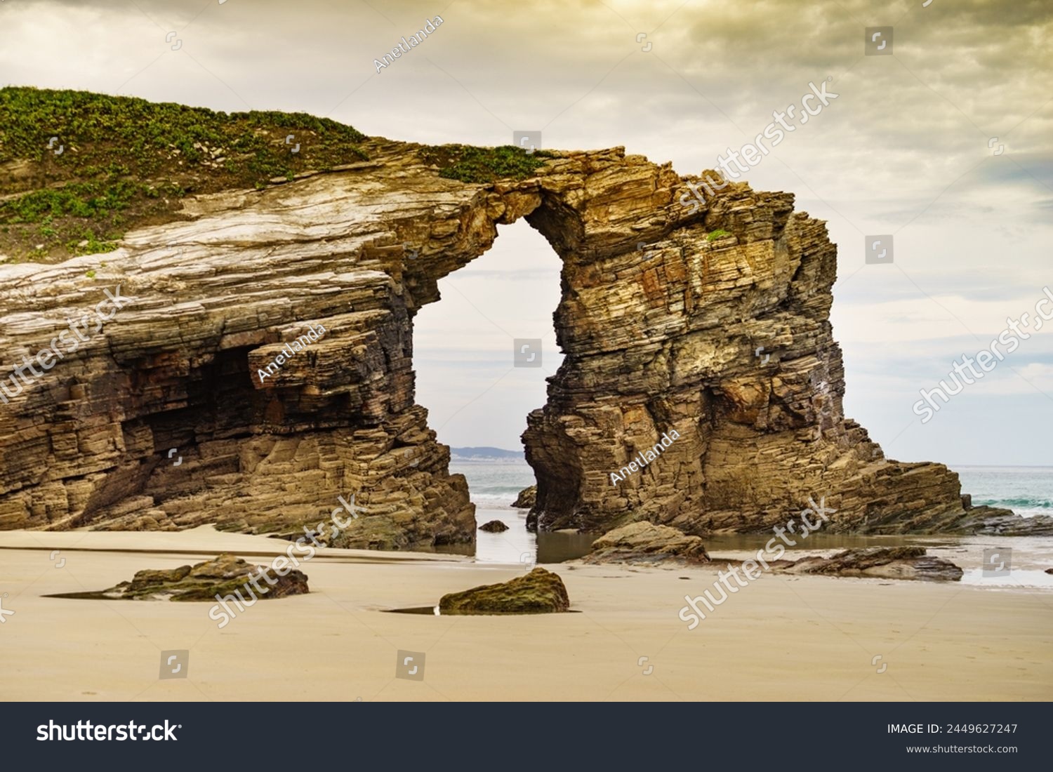 Beach of the Cathedrals, Playa las Catedrales in Ribadeo, province of Lugo, Galicia. Cliff formations on Cantabric coast in northern Spain. Tourist attraction. #2449627247