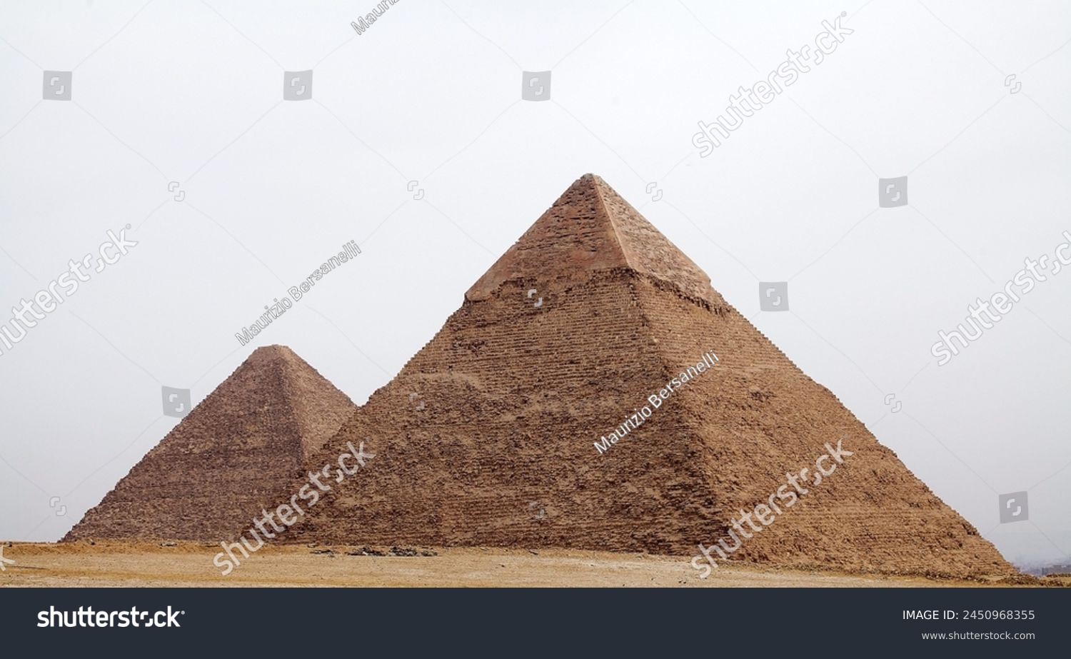 The Great Pyramid and Pyramid of Khefre at the Giza Pyramid Complex in Giza, Egypt, also called the Giza Necropolis. It was built during the Fourth Dynasty of the Old Kingdom #2450968355