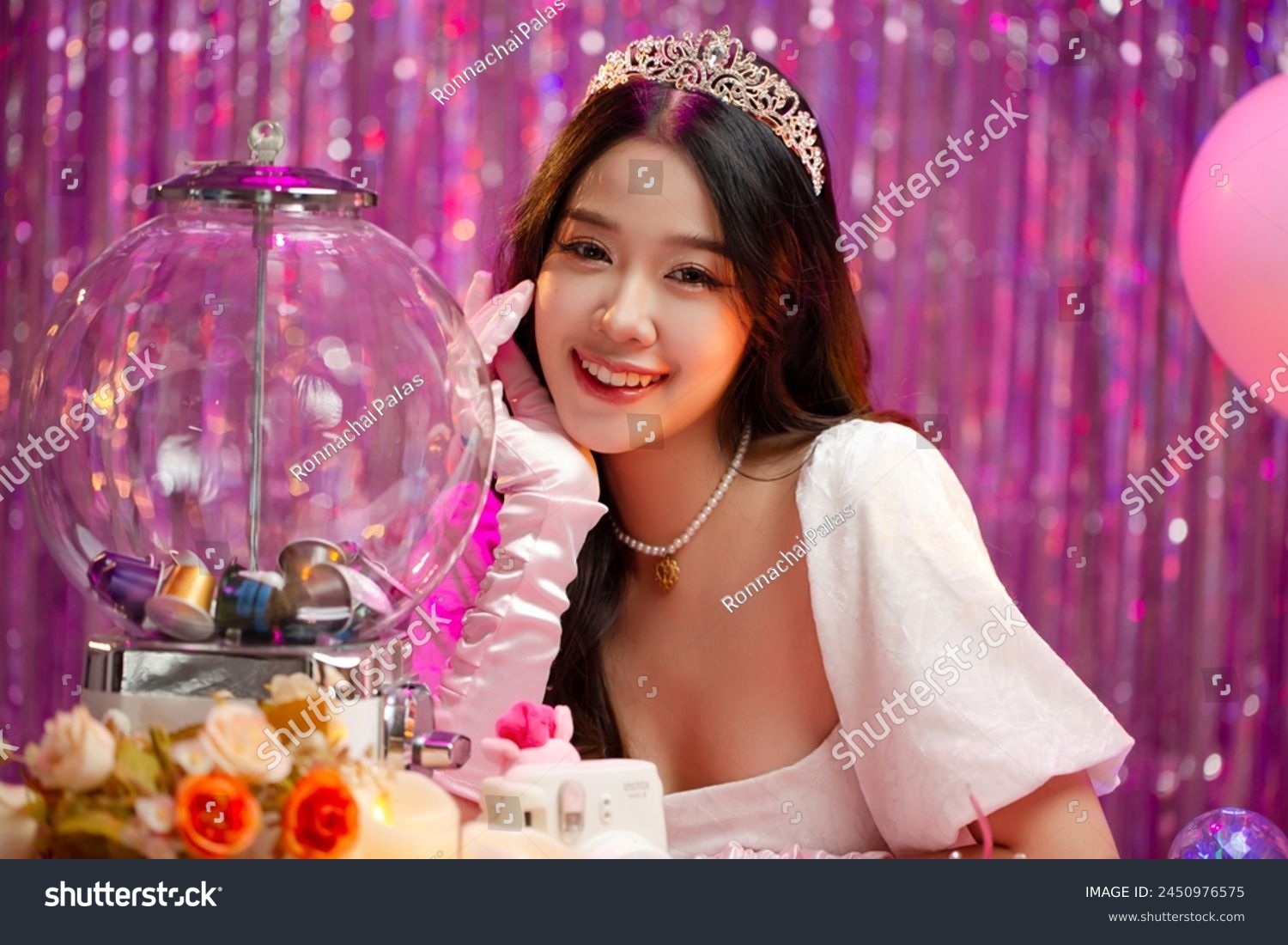 Happy beautiful Asian girl in princess dress showing birthday cake. Birthday princess photography theme is popular in social network. #2450976575