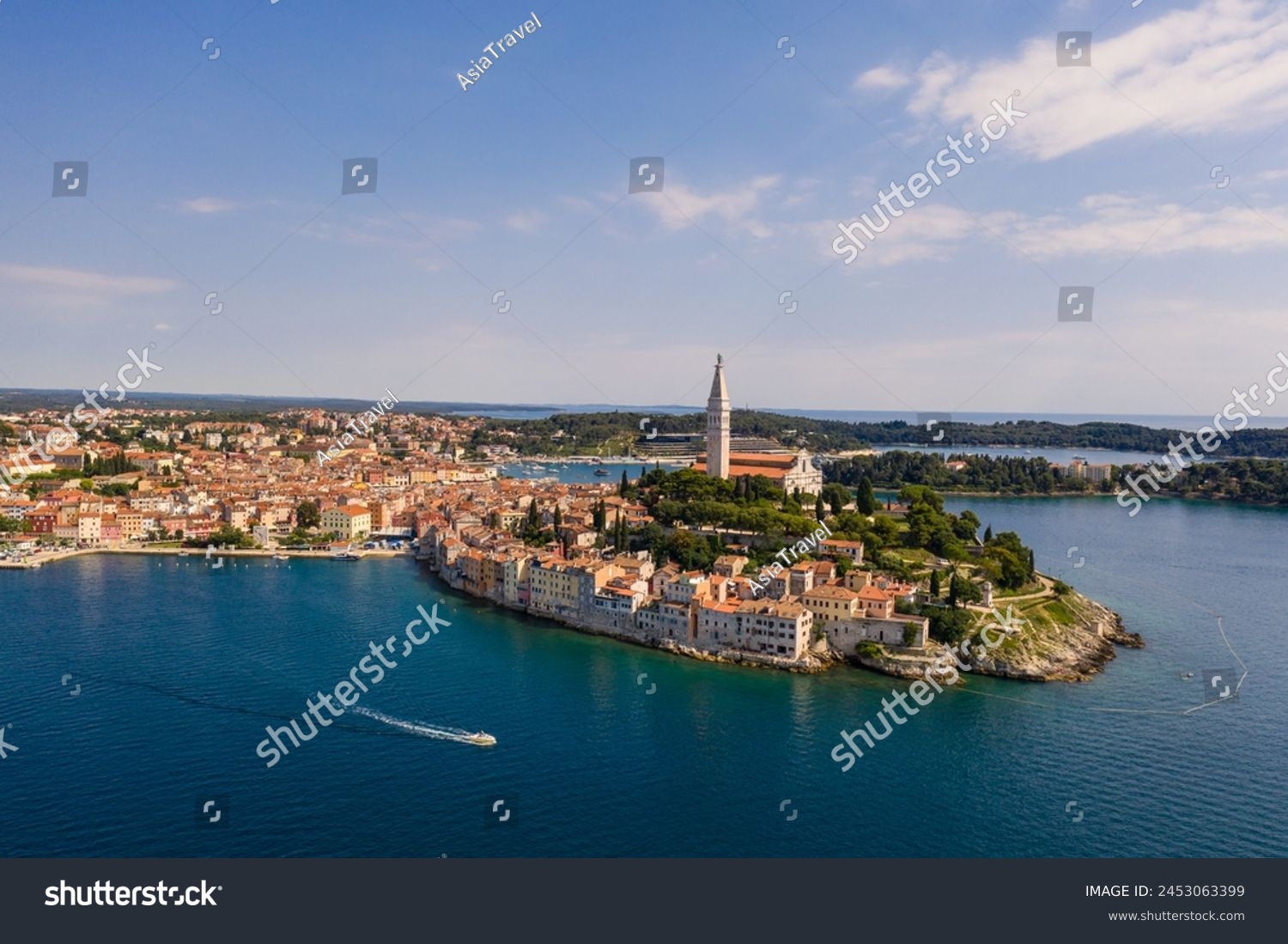 Rovinj, Croatia: Boat sailing around the Rovinj medieval old town with its Venetian campanile in Istria by the Adriatic sea in Croatia #2453063399