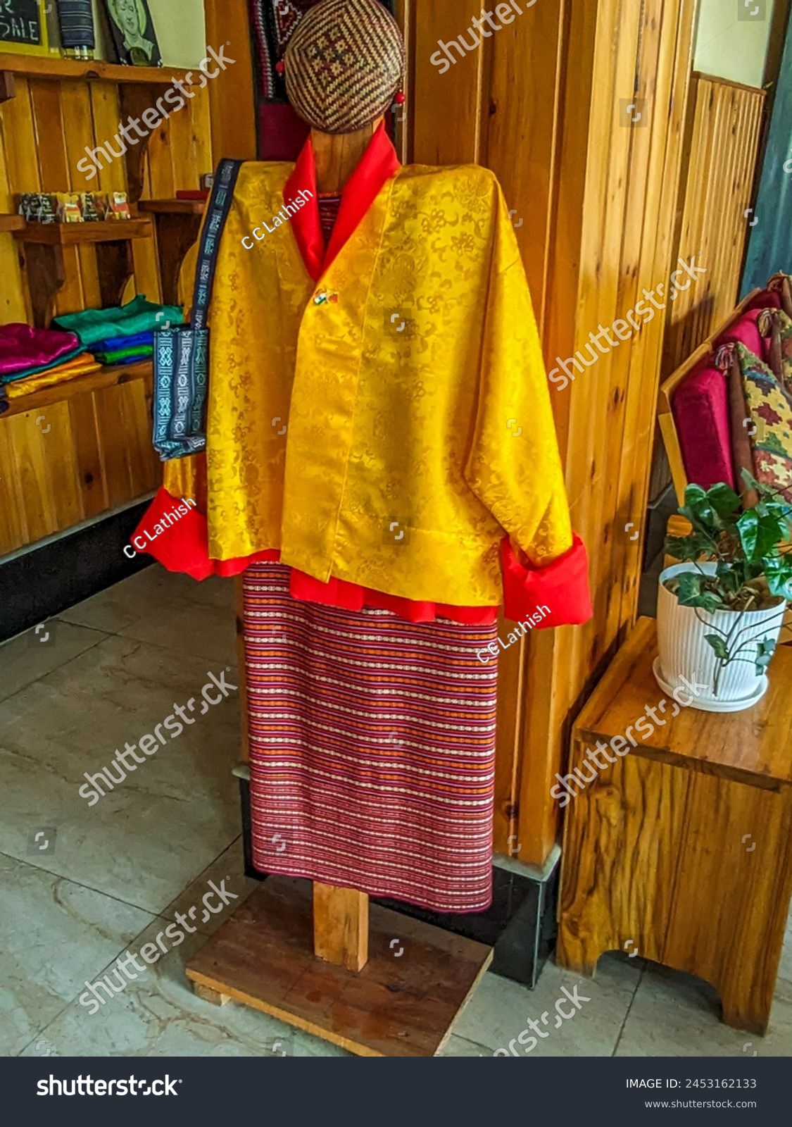 Bhutanese men's traditional dress, the gho, is a knee-length robe secured with a belt, symbolizing cultural pride and reflecting the nation's rich heritage. #2453162133