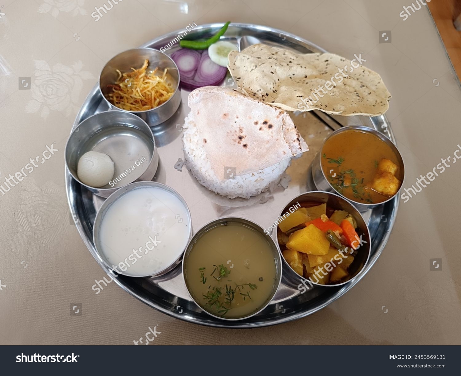 Indulge in a sumptuous dal sabji thali in Paro, a feast for the senses brimming with aromatic spices, vibrant colors, and flavors that evoke the essence of Bhutanese cuisine. #2453569131