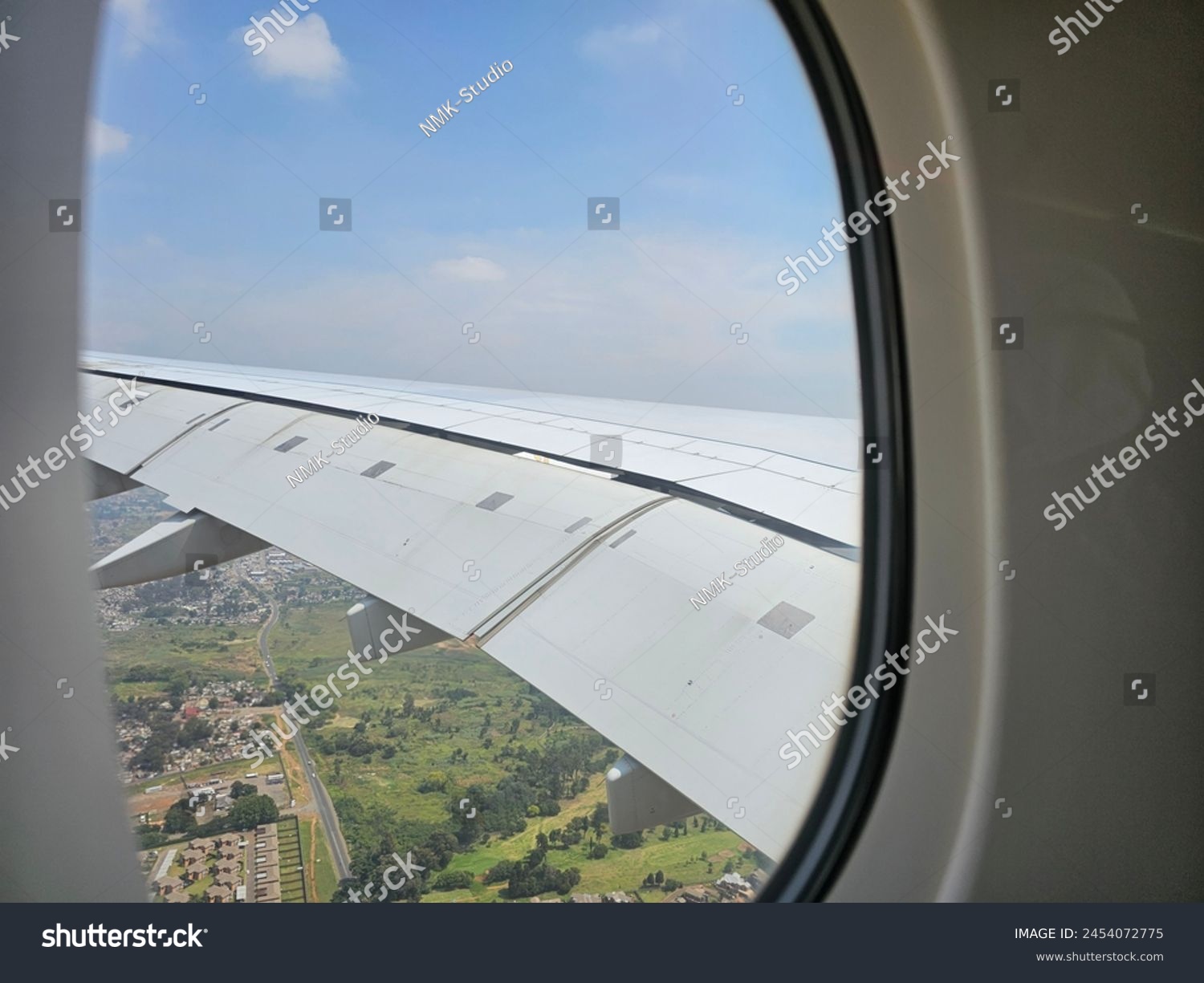 A View of the Wing of an Airplane From a Window #2454072775