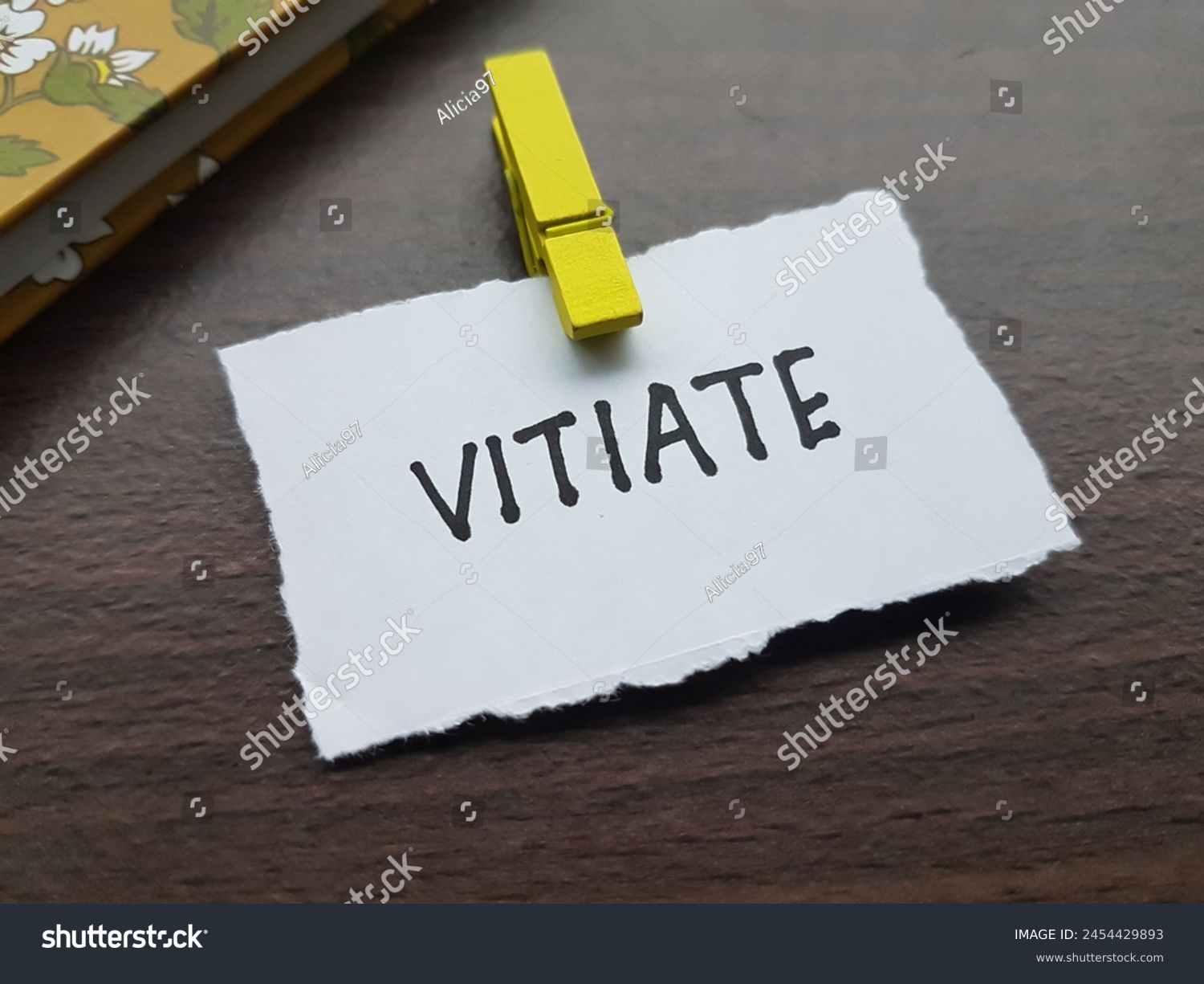 Vitiate writting on table background. #2454429893