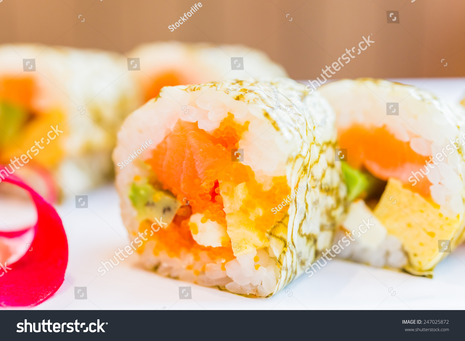 Salmon sushi roll maki - japanese food - selective focus #247025872