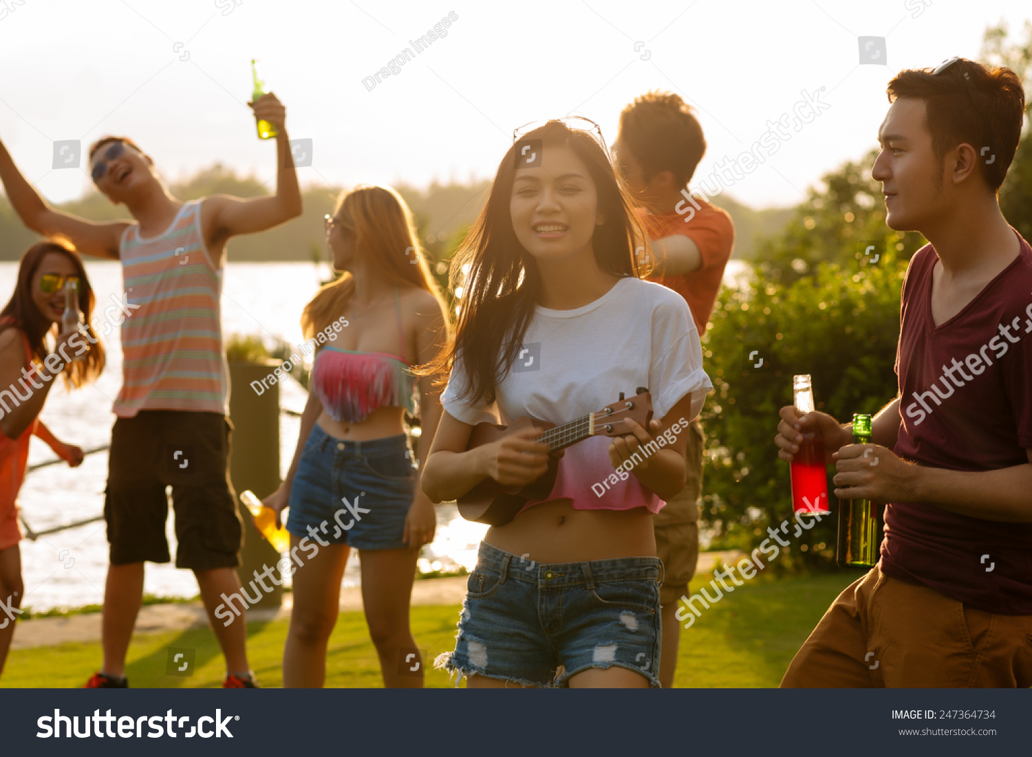 Cheerful Vietnamese friends having sunset party #247364734