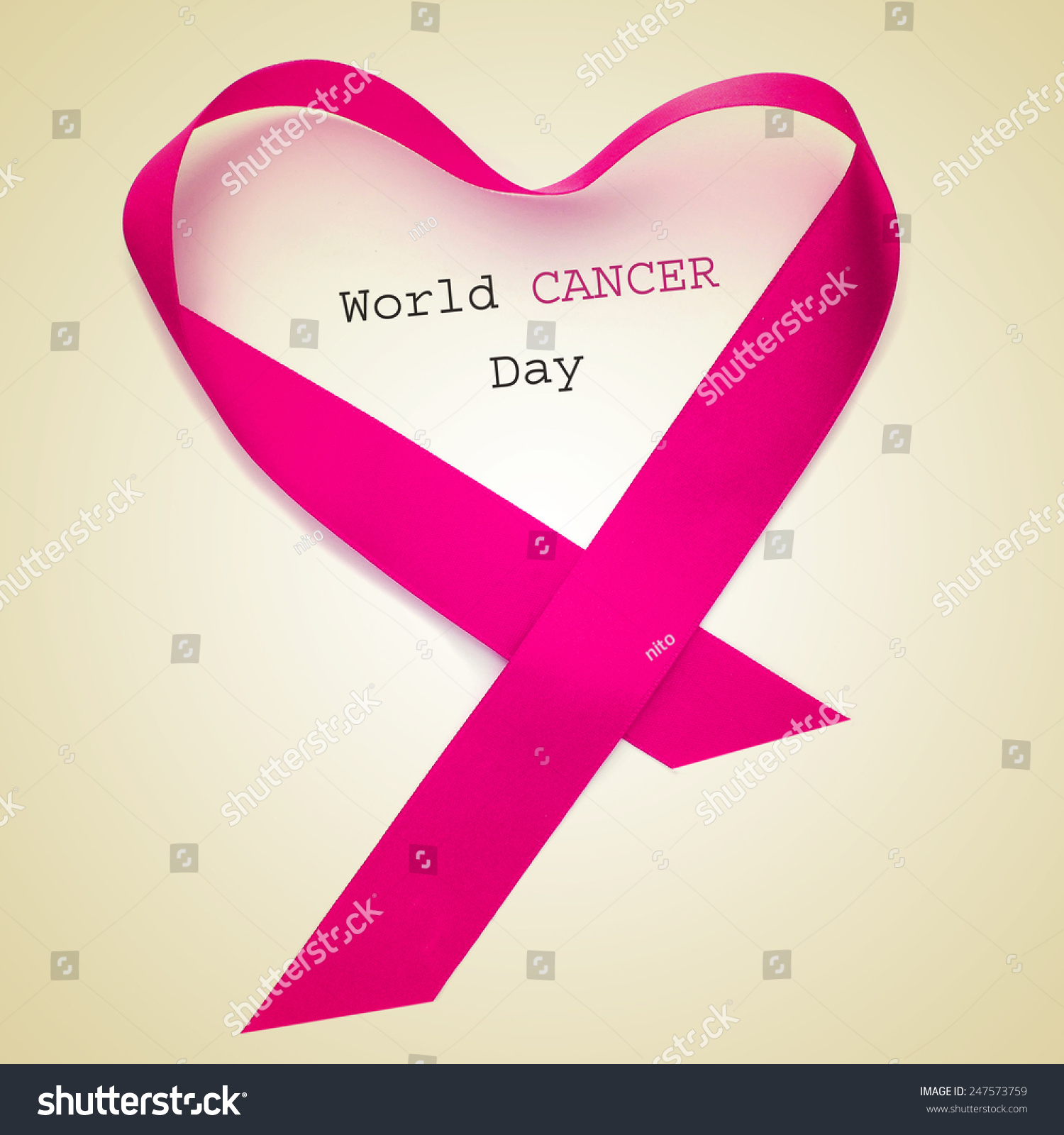 the text world cancer day and a pink ribbon forming a heart on a beige background #247573759