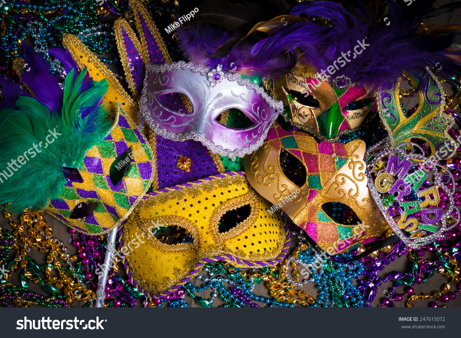 A group of venetian, mardi gras mask or disguise on a dark background #247615072