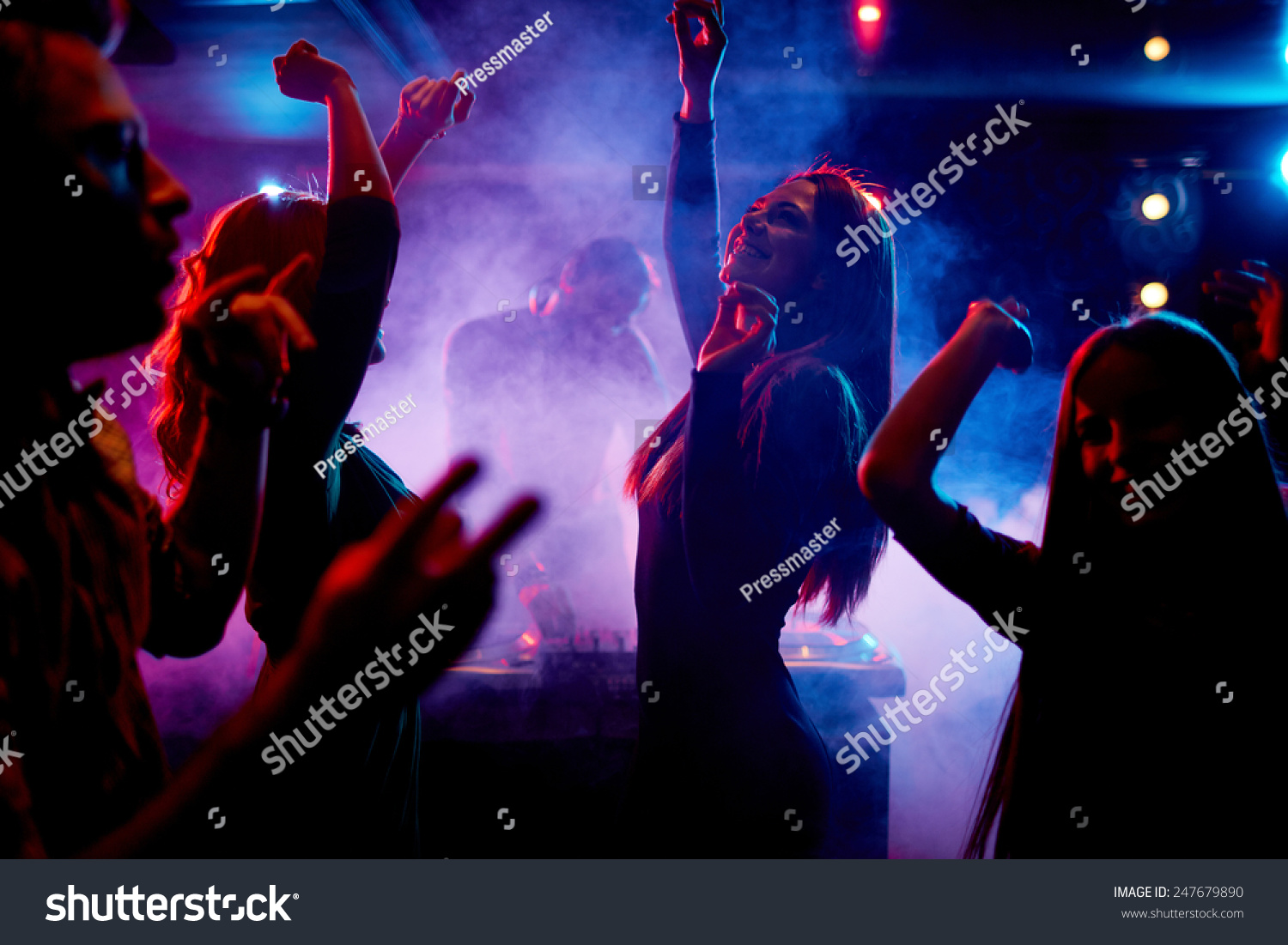 Group of dancing young people enjoying night in club #247679890