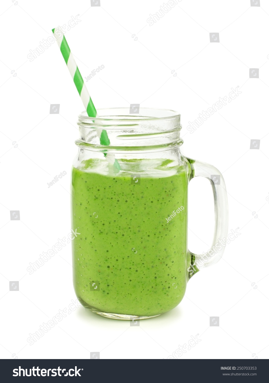 Healthy green smoothie with straw in a jar mug isolated on white #250703353