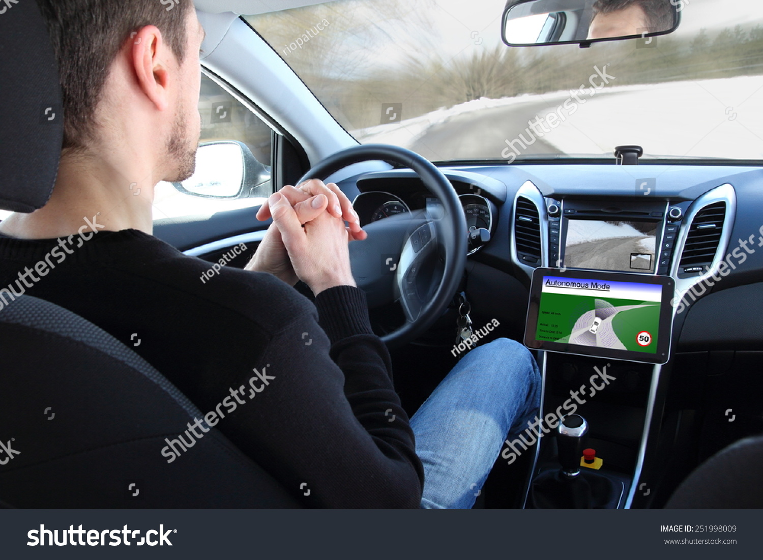 A man in a Autonomous driving  test vehicle #251998009