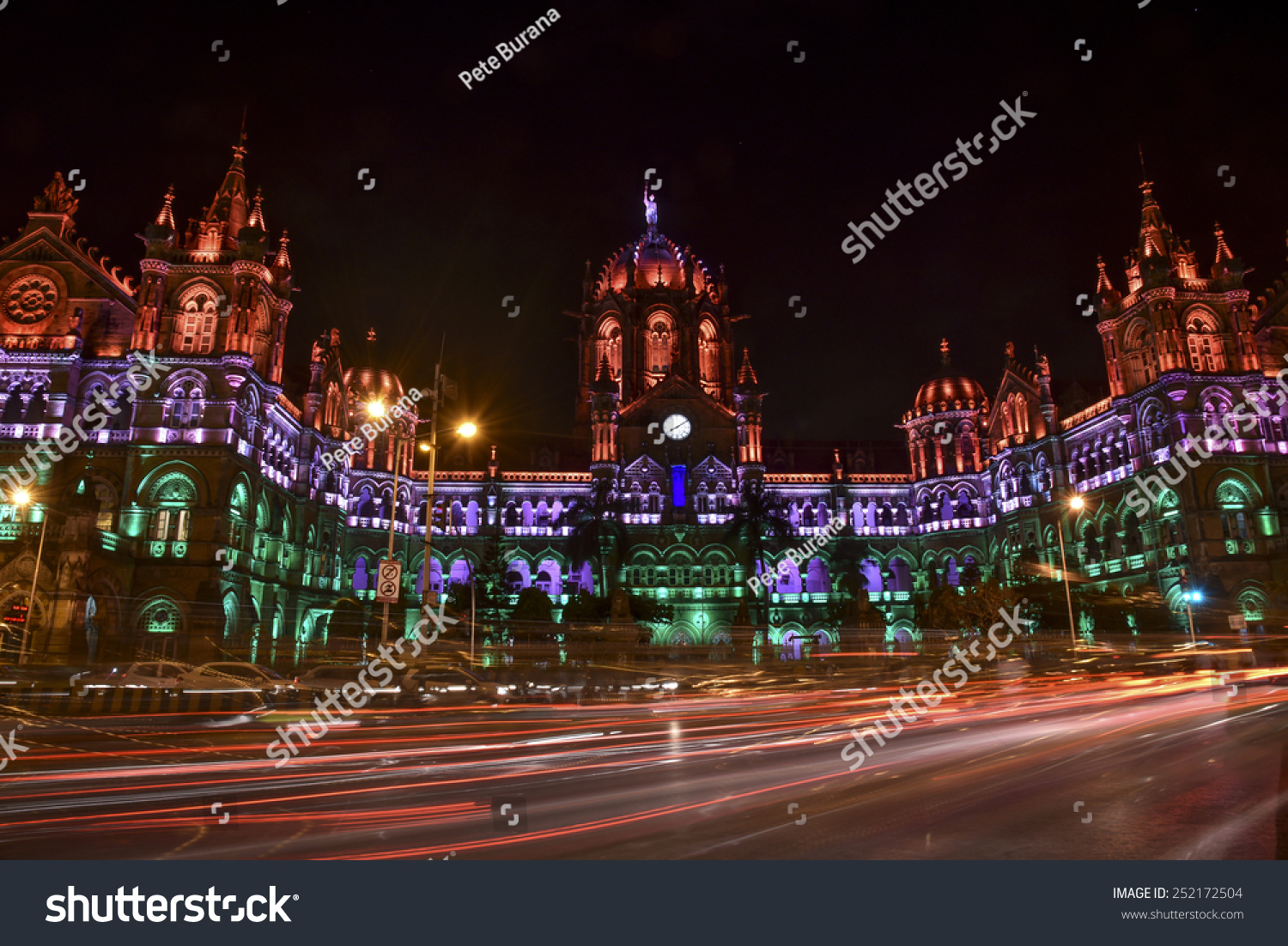 Mumbai, India - January 26, 2015 - Chhatrapati Shivaji Terminus (Victoria Terminus) illuminated with multi-colored lights in the evening for India Republic Day #252172504