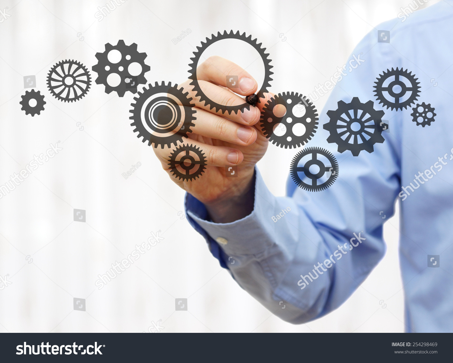 engineer draws a chain sprockets. Technology and industry concept #254298469