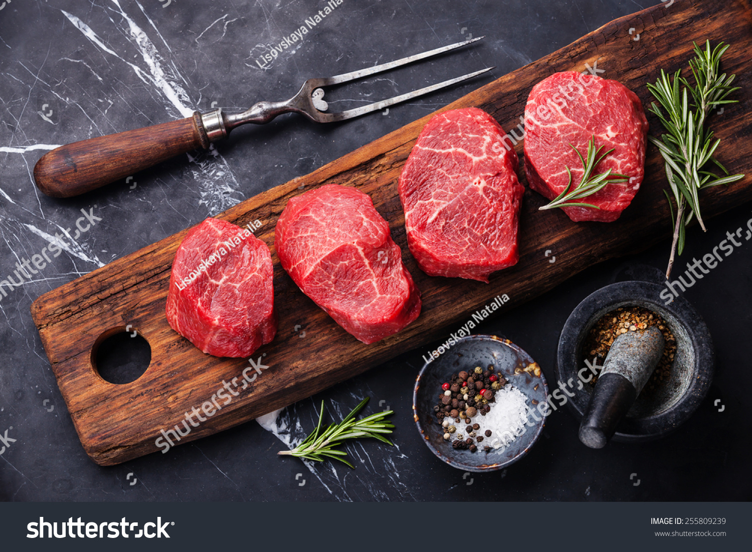 Raw fresh marbled meat Steak and seasonings on dark marble background #255809239