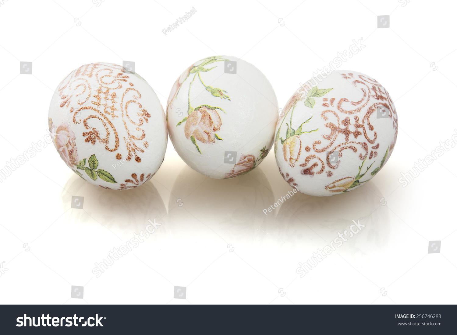 Three beautiful Easter eggs with reflection on the white background. #256746283