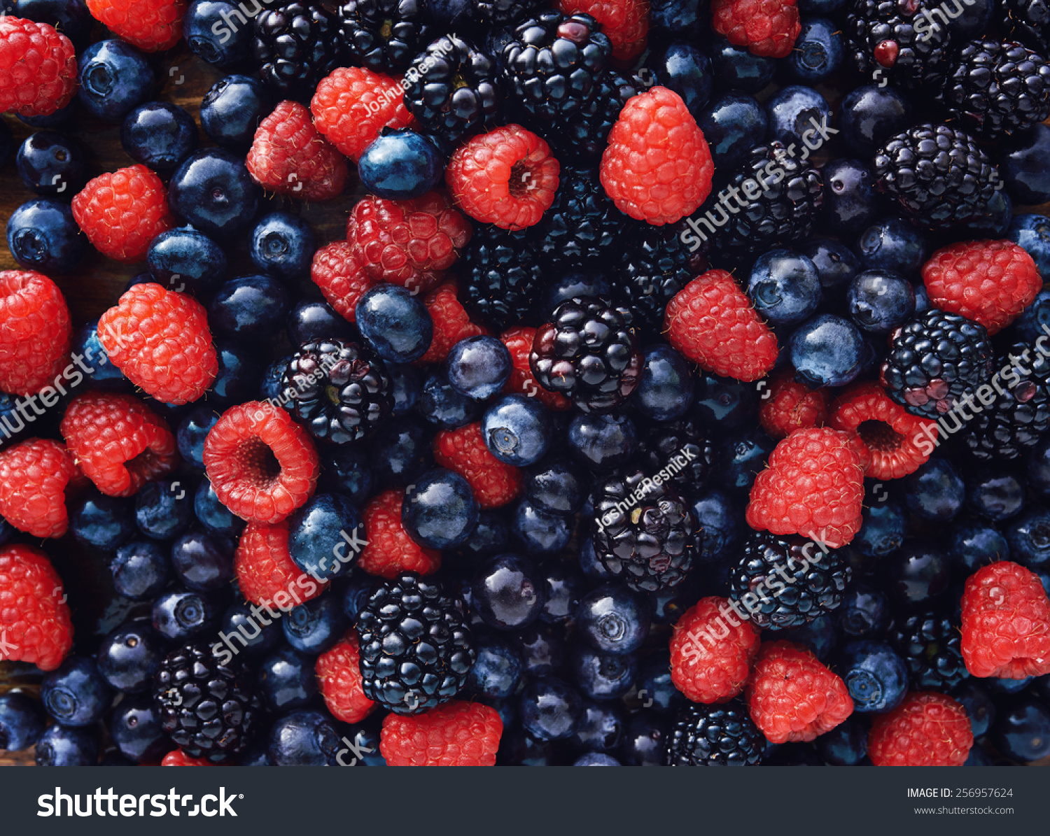 blueberries, raspberries and black berries shot top down #256957624