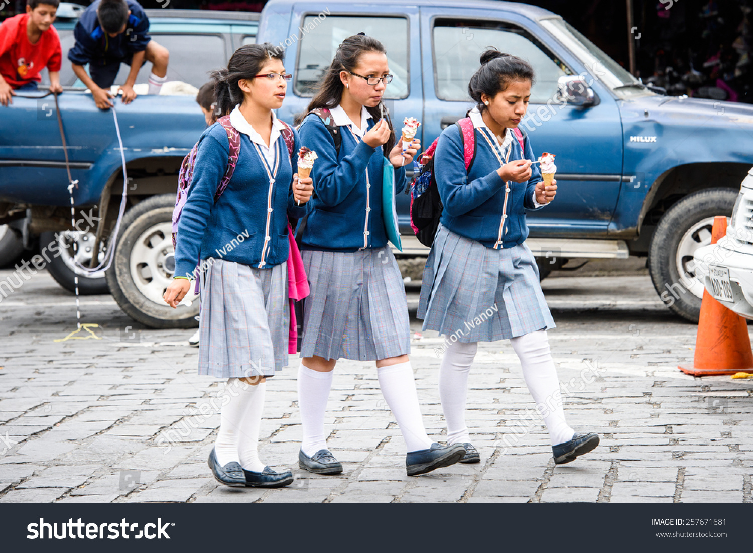 CUENCA, ECUADOR - JAN 9, 2015: Unidentified Ecuadorian girls walk in the street. 71,9% of Ecuadorian people belong to the Mestizo ethnic group #257671681
