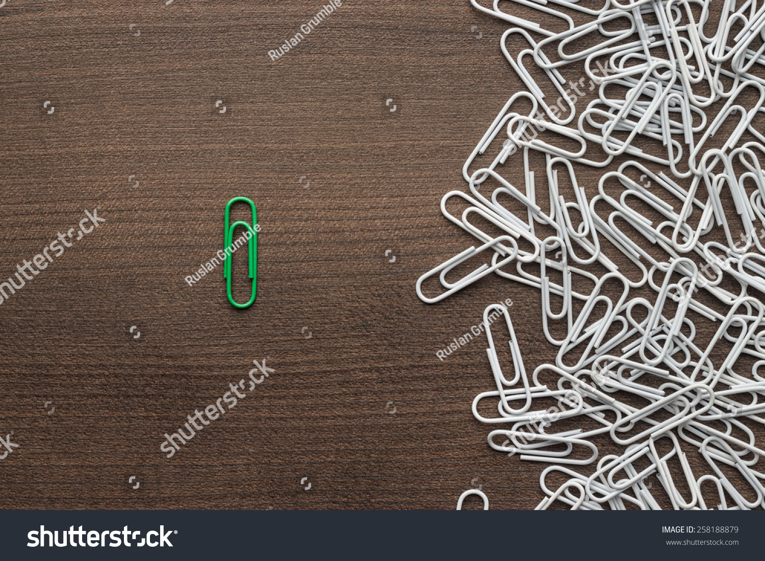 bright green paper clip unique idea concept #258188879