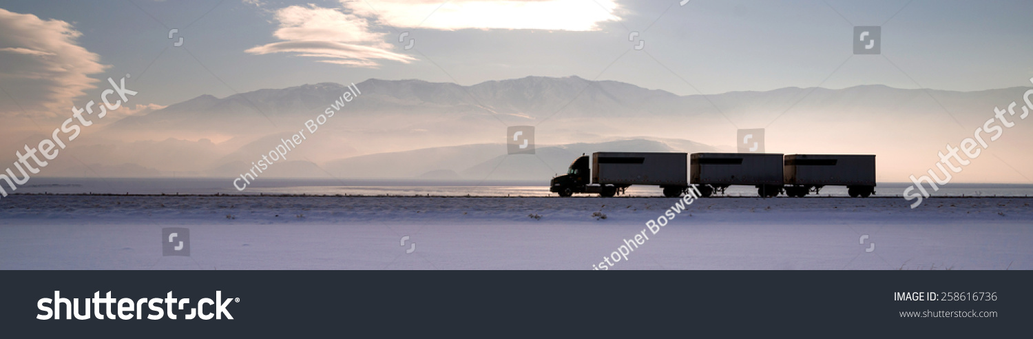 Semi Truck Travels Highway Over Salt Flats Freight Transport #258616736