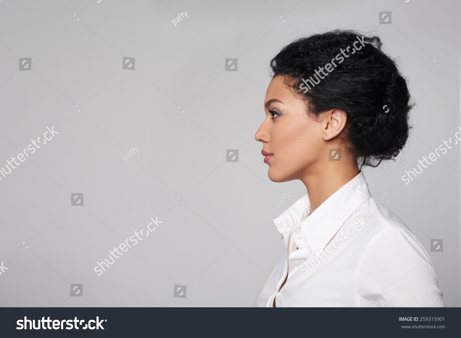 Closeup profile of confident business woman looking forward isolated on gray background #259315901