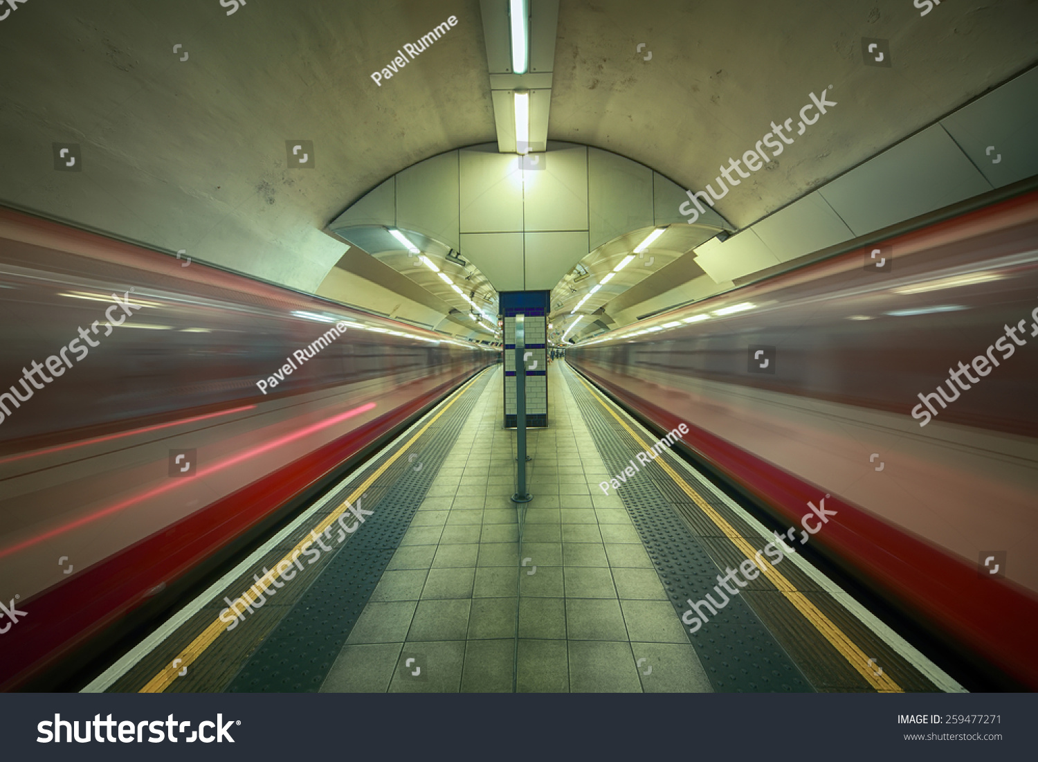 underground station in London with two passing trains #259477271