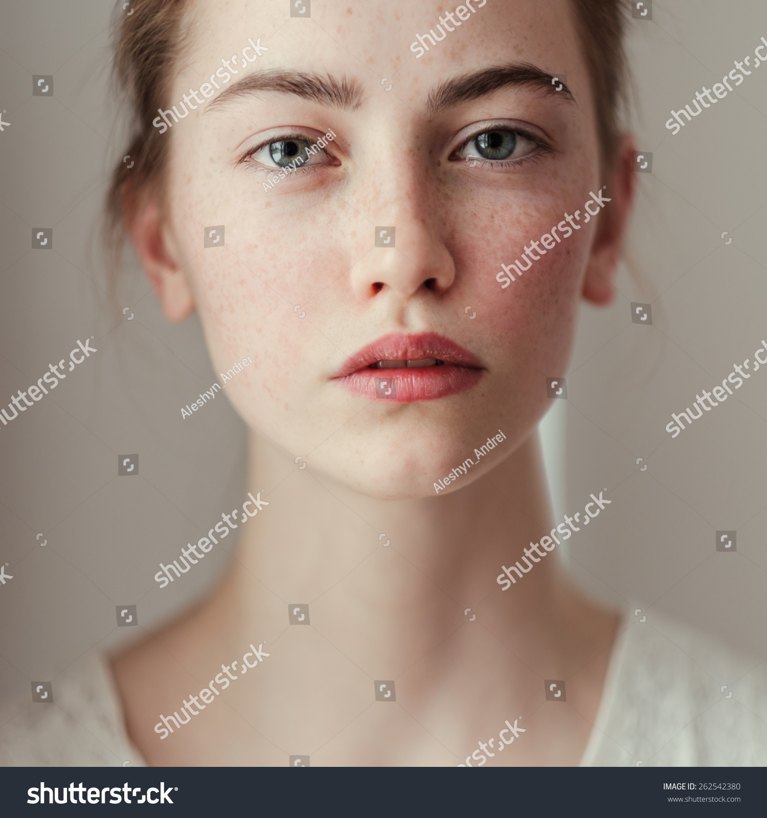 Morning portrait of a beautiful young girl with freckles #262542380
