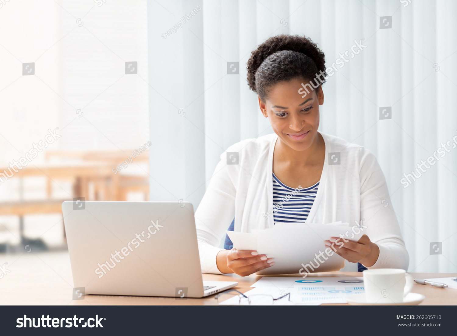 Businessowman working with papers in office #262605710