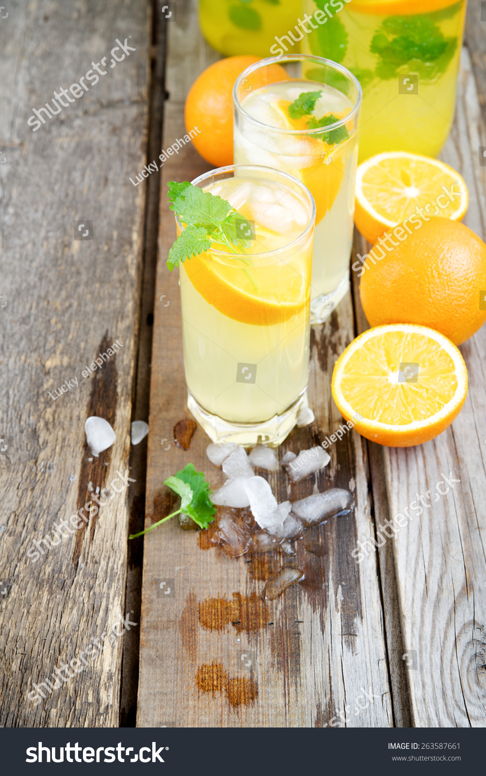 Cold orange soda in a glass on a wooden background #263587661