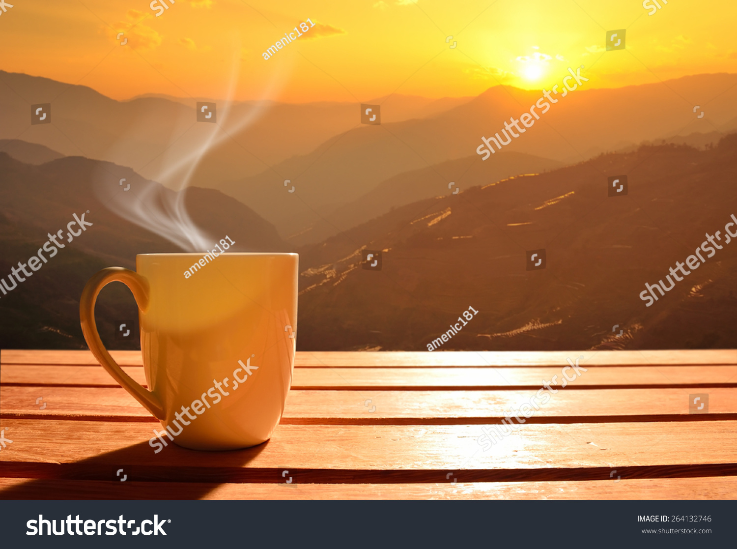 Morning cup of coffee with mountain background at sunrise #264132746