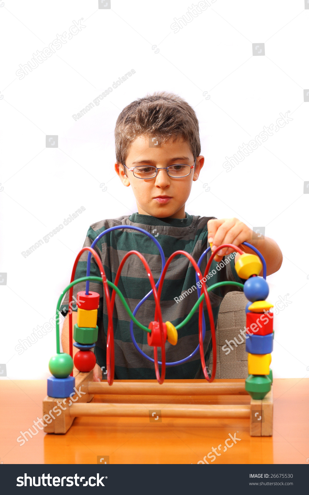 Little boy playing with colorful blocks #26675530